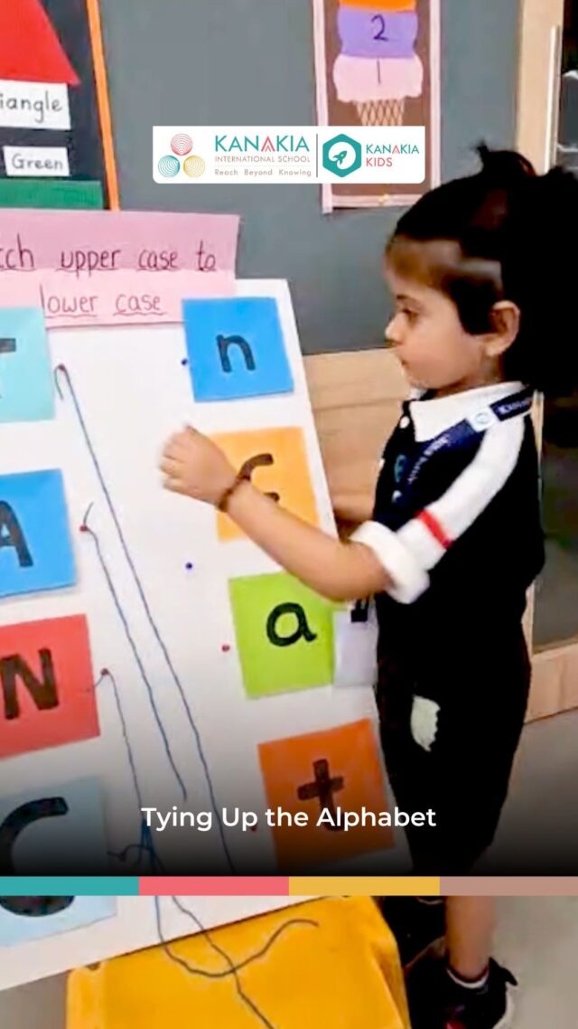 Grade K1 learners matching uppercase and lowercase letters